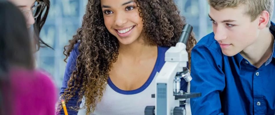 Online high school clubs encourage student collaboration through science experiments and peer interaction with microscopes.