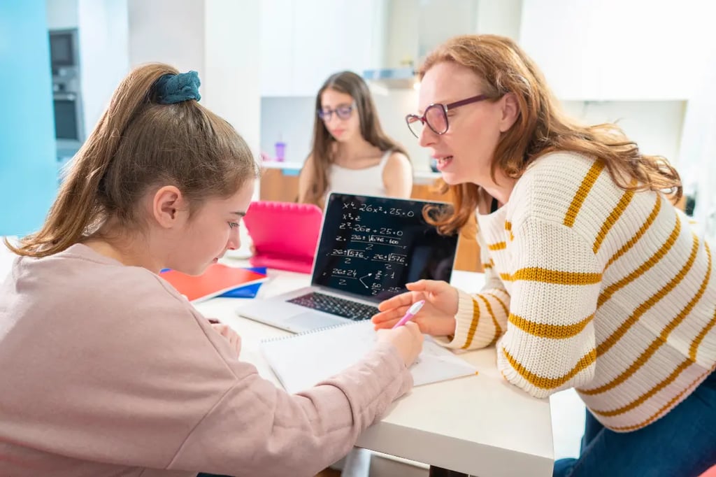 Mother assisting student with math lessons, ideal for online middle school education programs