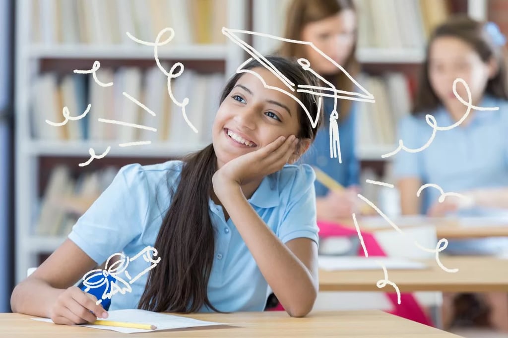 Accredited online middle school represented by a smiling student imagining graduation symbols while studying in a classroom setting.